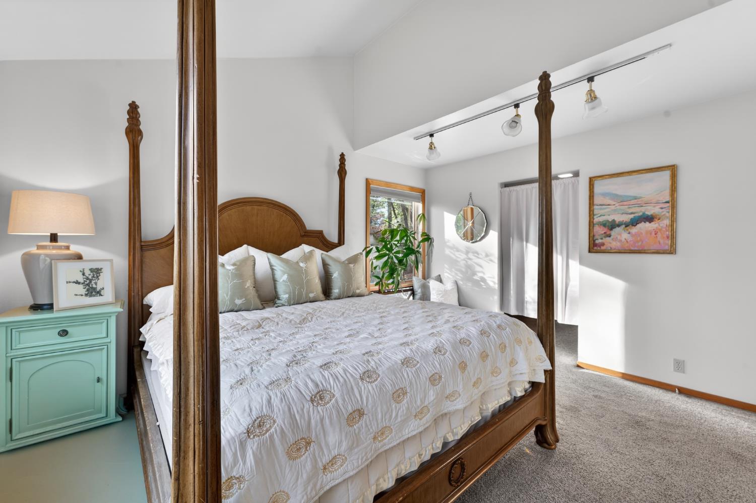 18370 Norlene Way Grass Valley, CA 95949 - Photo 14 of 46 a bedroom with a large bed and a window