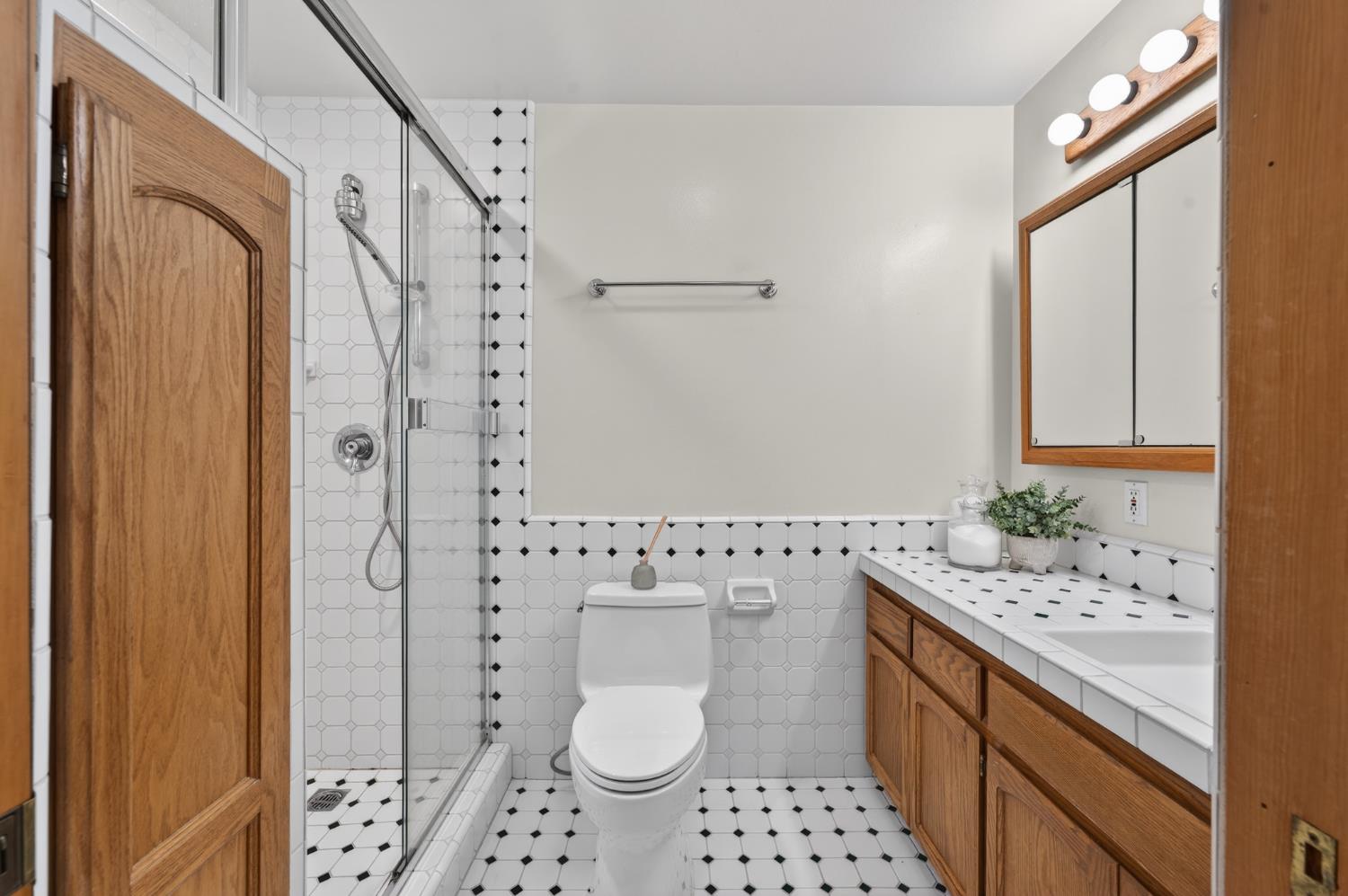 18370 Norlene Way Grass Valley, CA 95949 - Photo 15 of 46 a bathroom with a sink toilet and shower