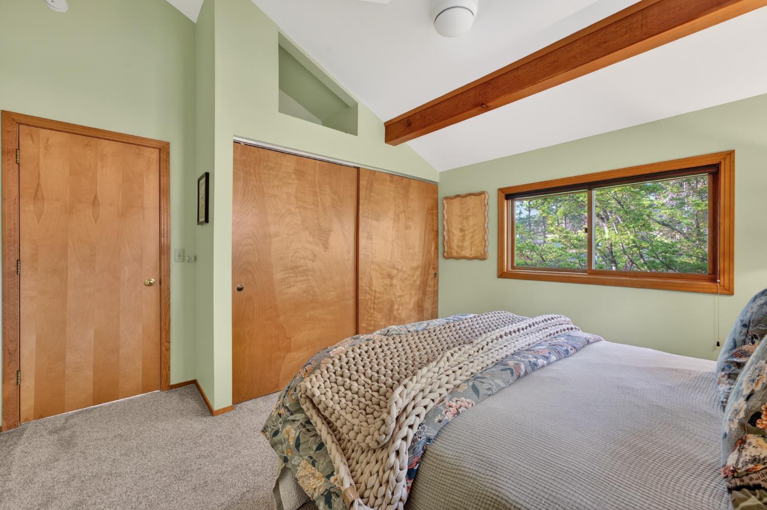 18370 Norlene Way Grass Valley, CA 95949 - Photo 22 of 46 a bedroom with a bed and a window