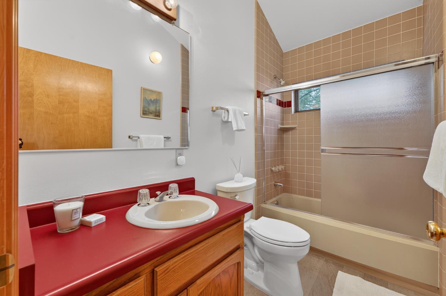 18370 Norlene Way Grass Valley, CA 95949 - Photo 24 of 46 a bathroom with a sink a toilet and shower