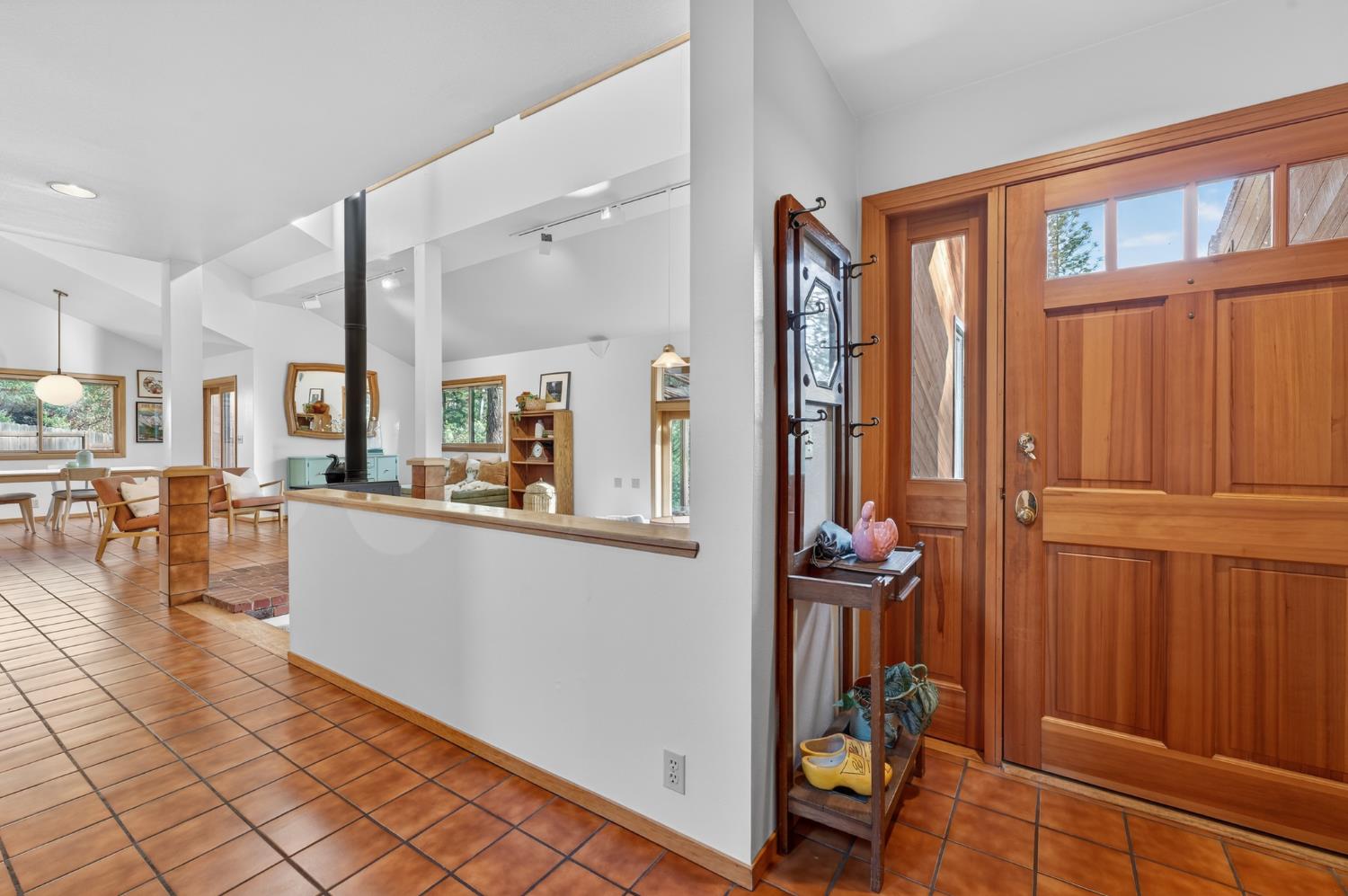 18370 Norlene Way Grass Valley, CA 95949 - Photo 33 of 46 a view of a hallway with dining area and glass door