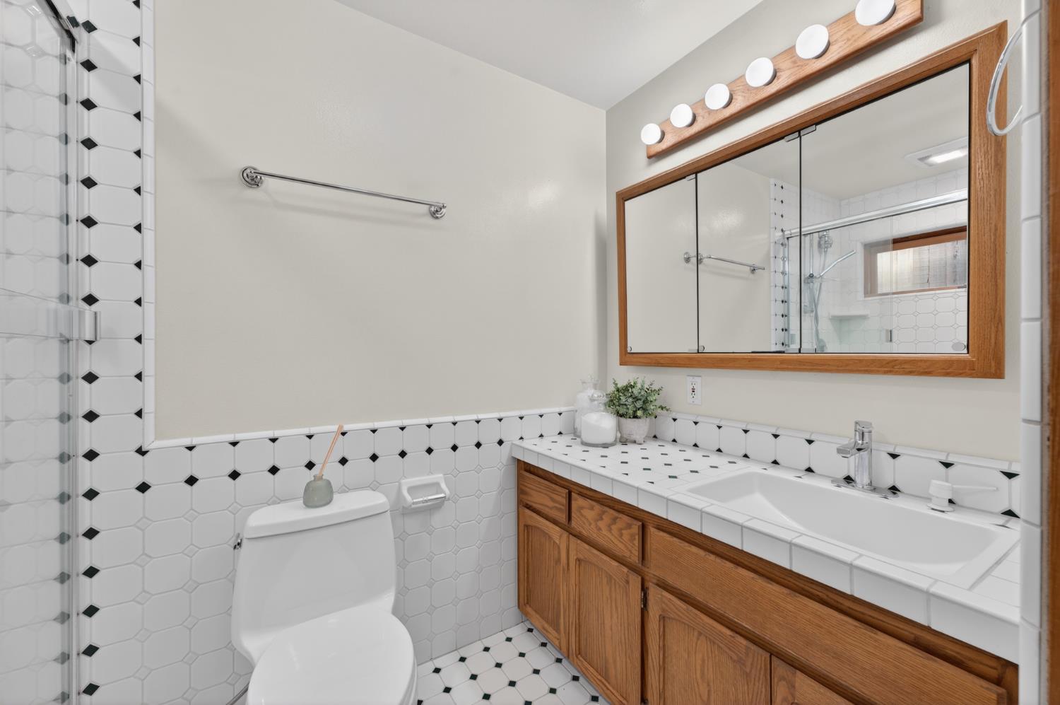 18370 Norlene Way Grass Valley, CA 95949 - Photo 38 of 46 a bathroom with a sink toilet and mirror