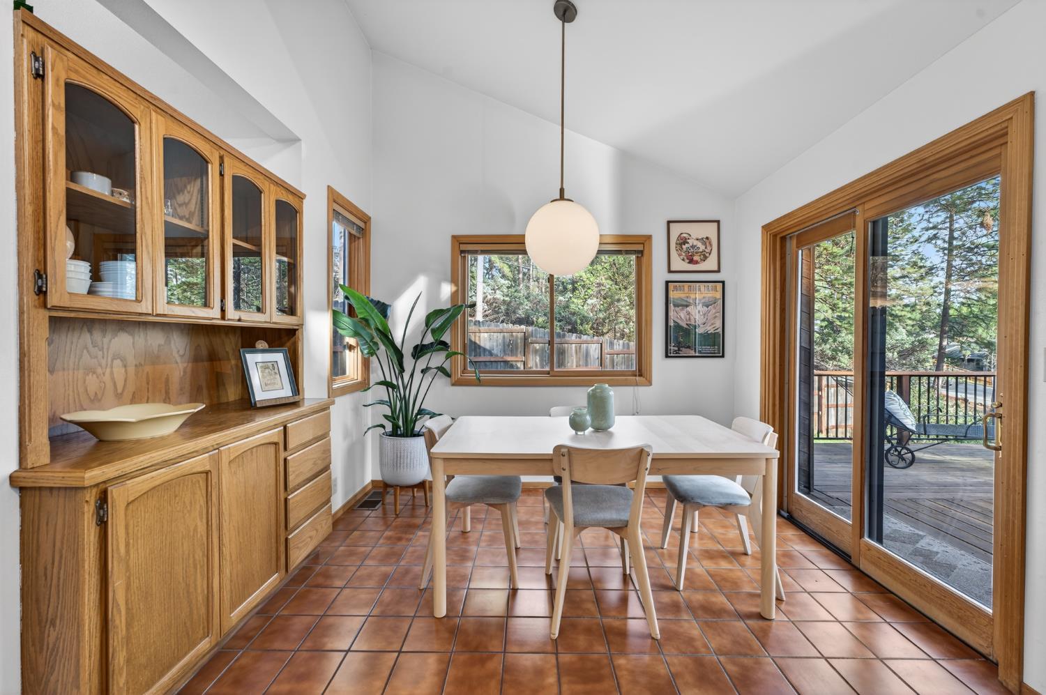 18370 Norlene Way Grass Valley, CA 95949 - Photo 6 of 46 a view of a dining room with furniture large windows and wooden floor