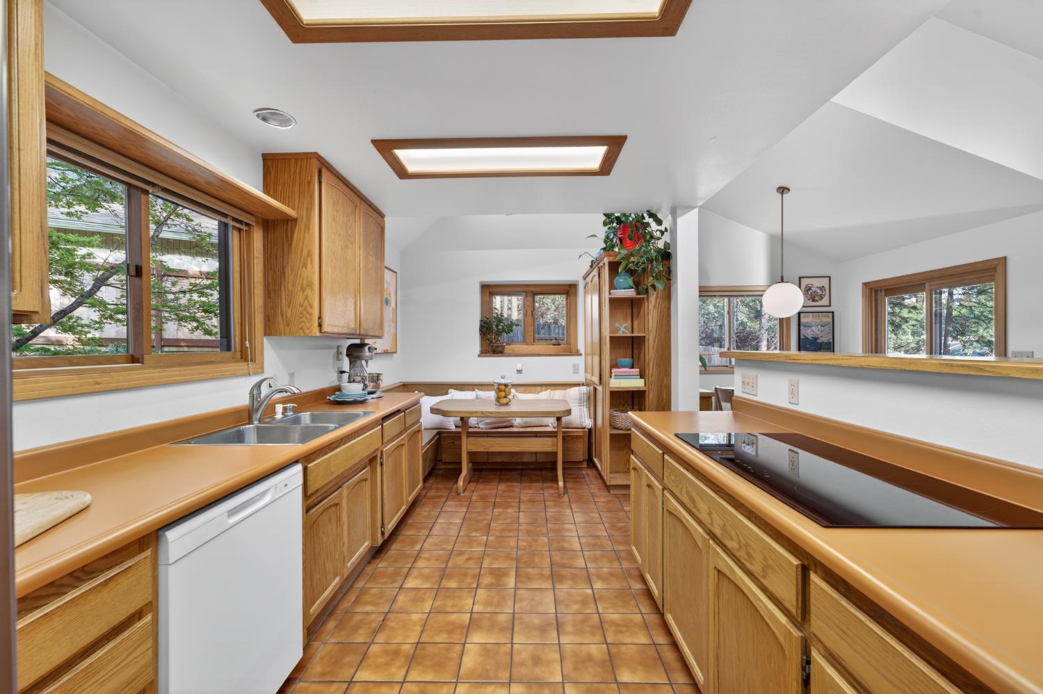 18370 Norlene Way Grass Valley, CA 95949 - Photo 7 of 46 a large kitchen with kitchen island a large window in it