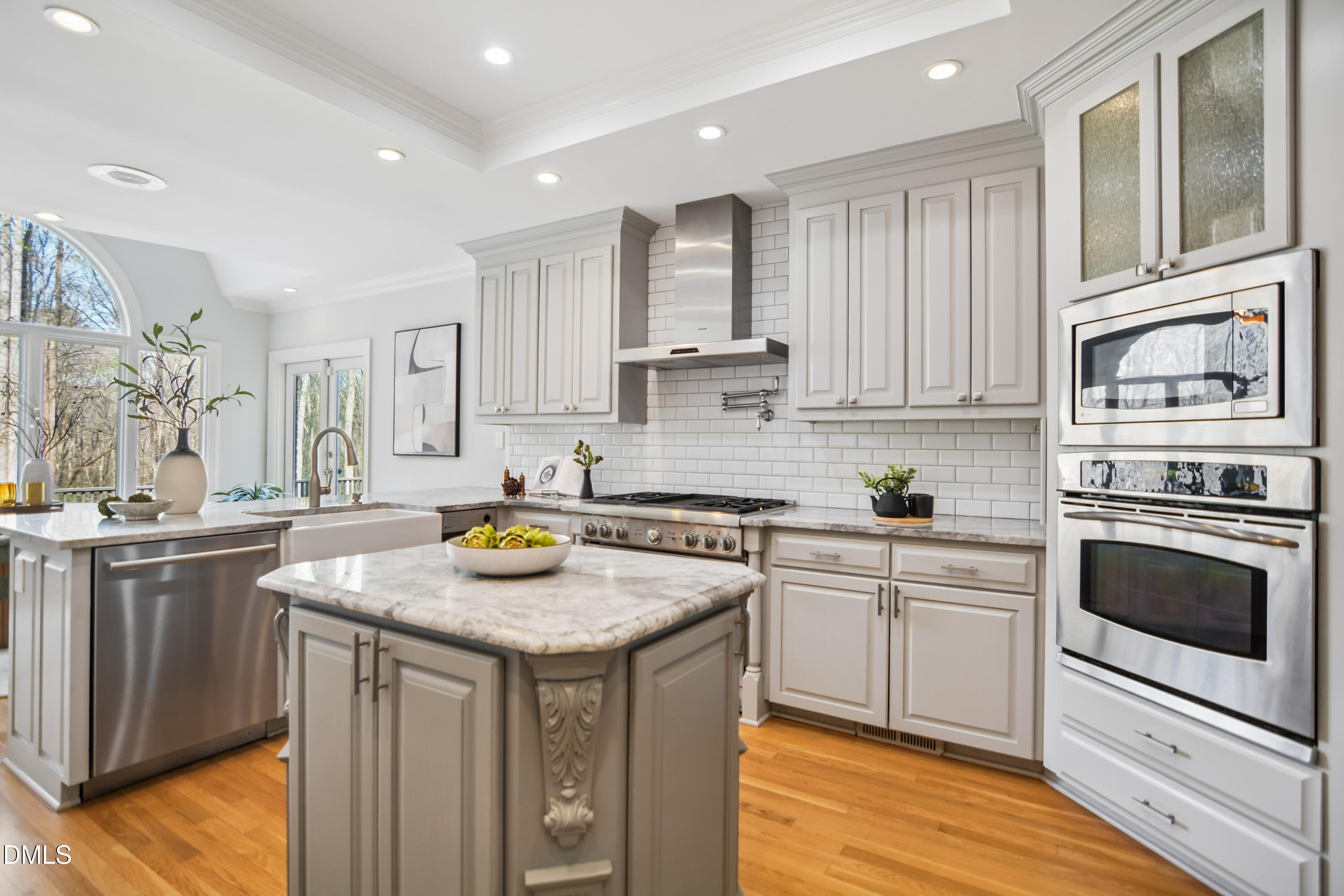 9933 Koupela Drive Raleigh, NC 27614 - Photo 17 of 59 a kitchen with stainless steel appliances granite countertop a stove and a sink