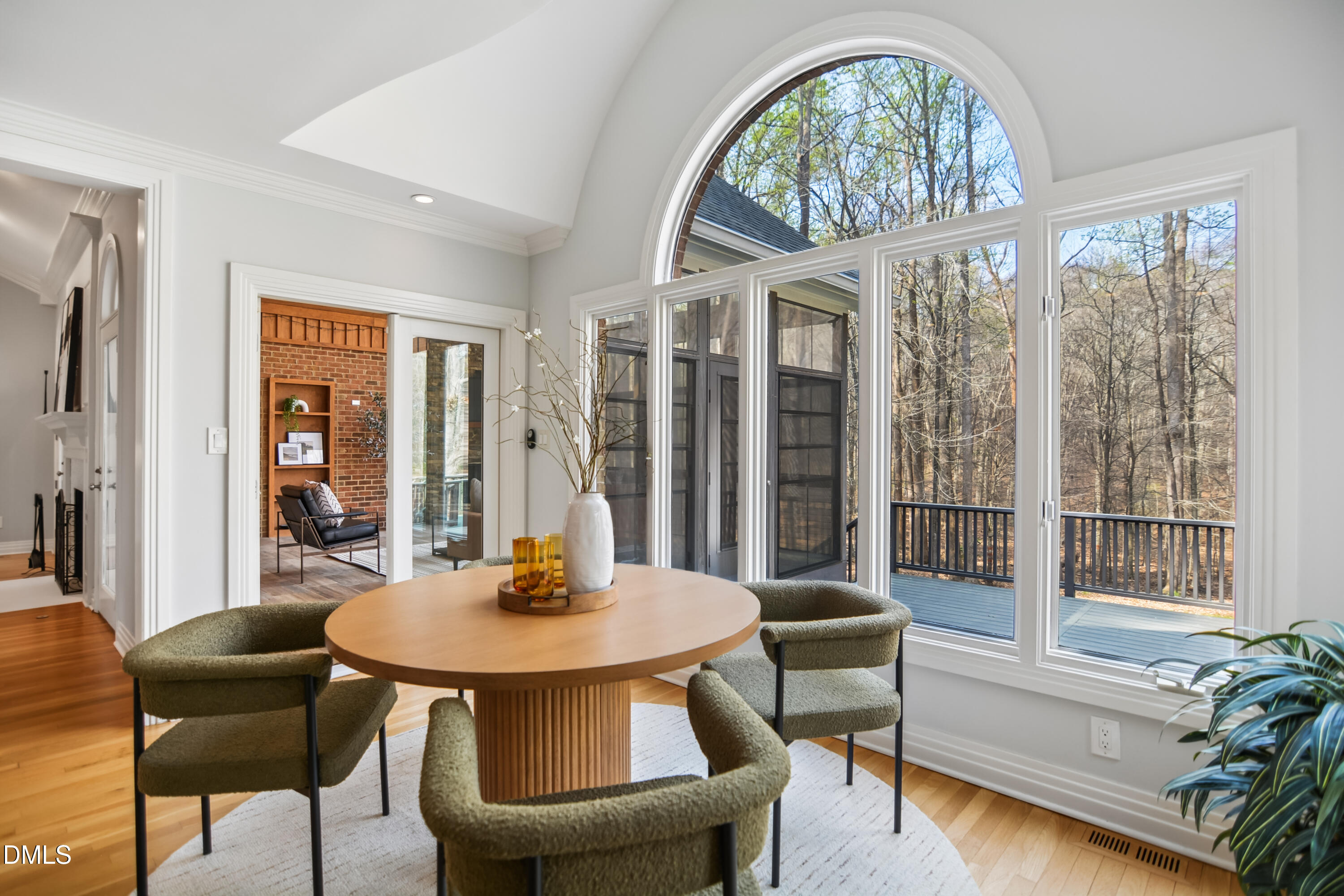 9933 Koupela Drive Raleigh, NC 27614 - Photo 20 of 59 a dining room with furniture a chandelier and wooden floor