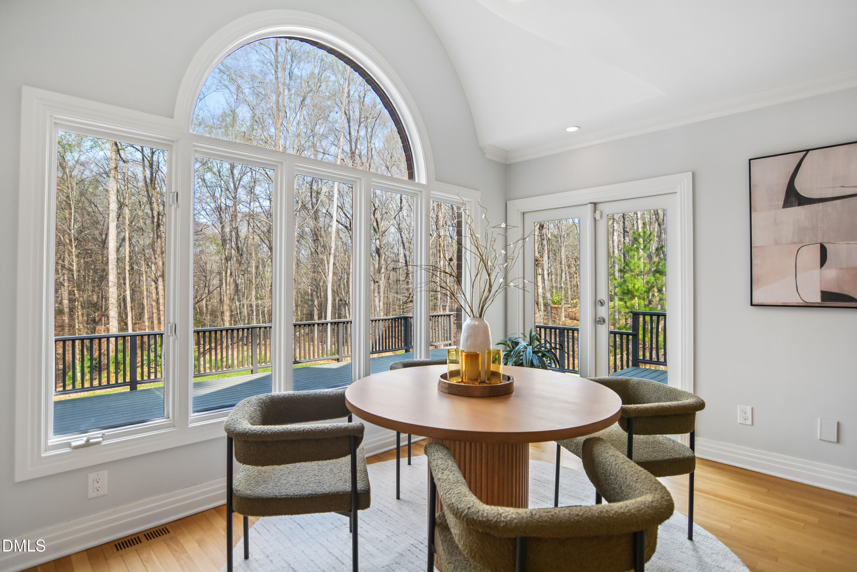 9933 Koupela Drive Raleigh, NC 27614 - Photo 21 of 59 a dining room with furniture a chandelier and wooden floor