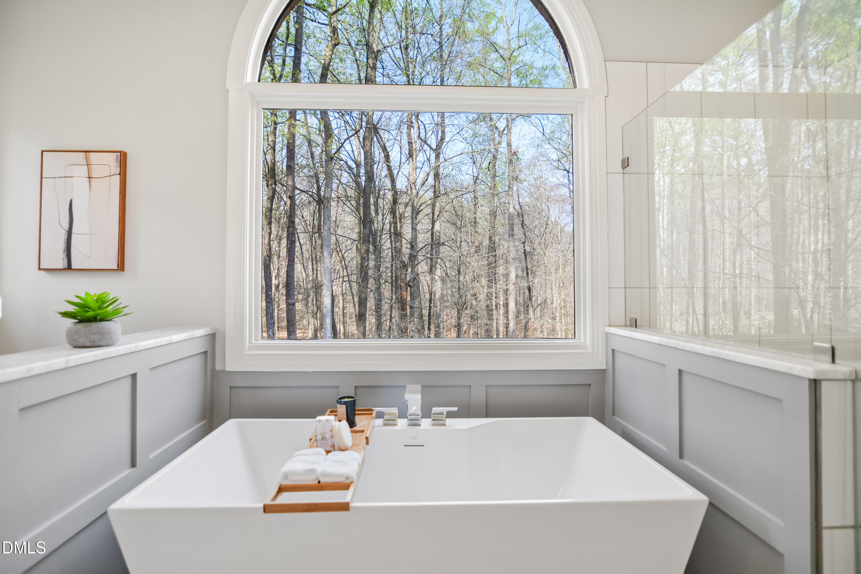 9933 Koupela Drive Raleigh, NC 27614 - Photo 27 of 59 a white bath tub sitting in a bathroom next to a window