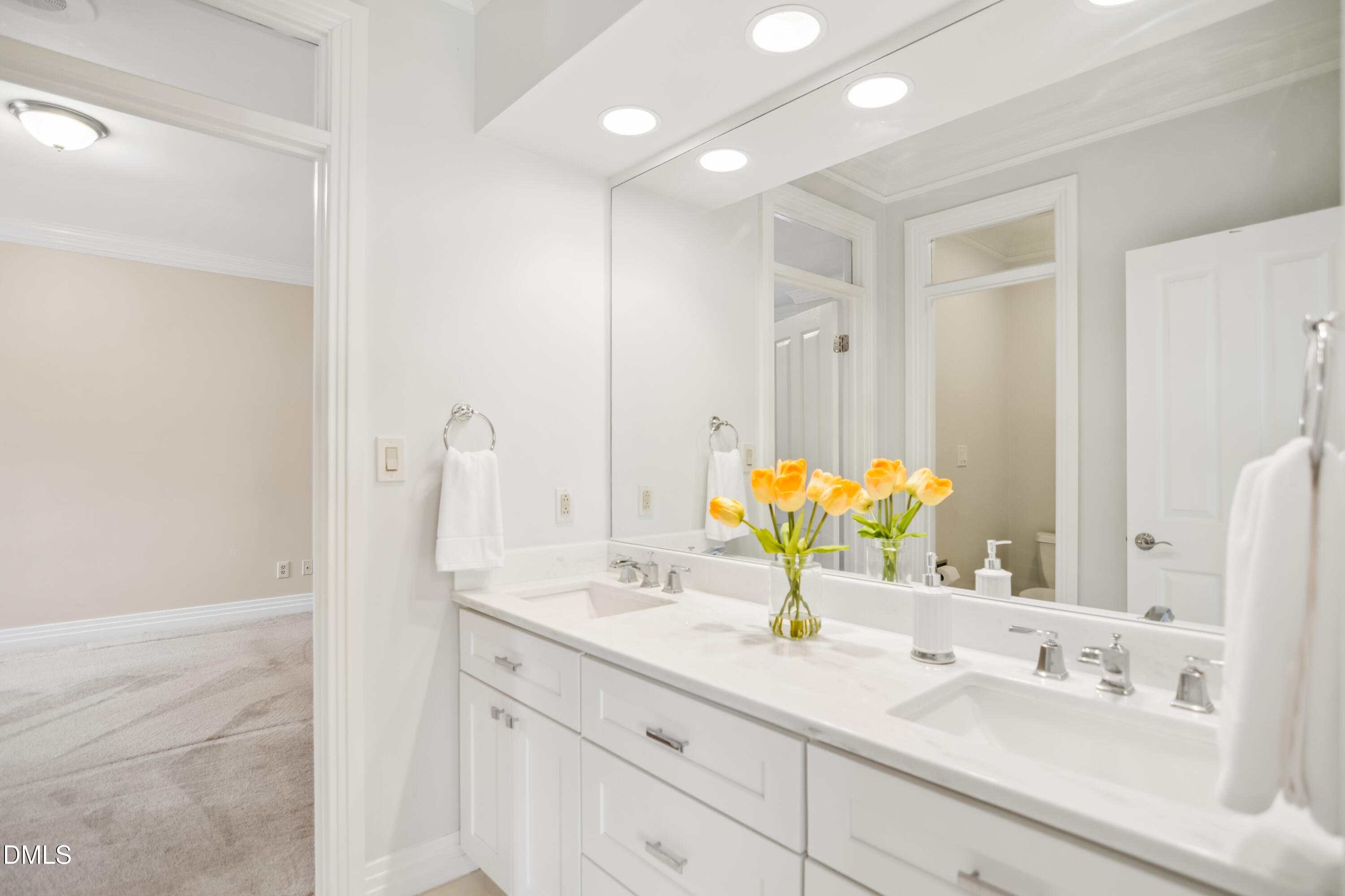 9933 Koupela Drive Raleigh, NC 27614 - Photo 32 of 59 a bathroom with a sink double vanity and a mirror