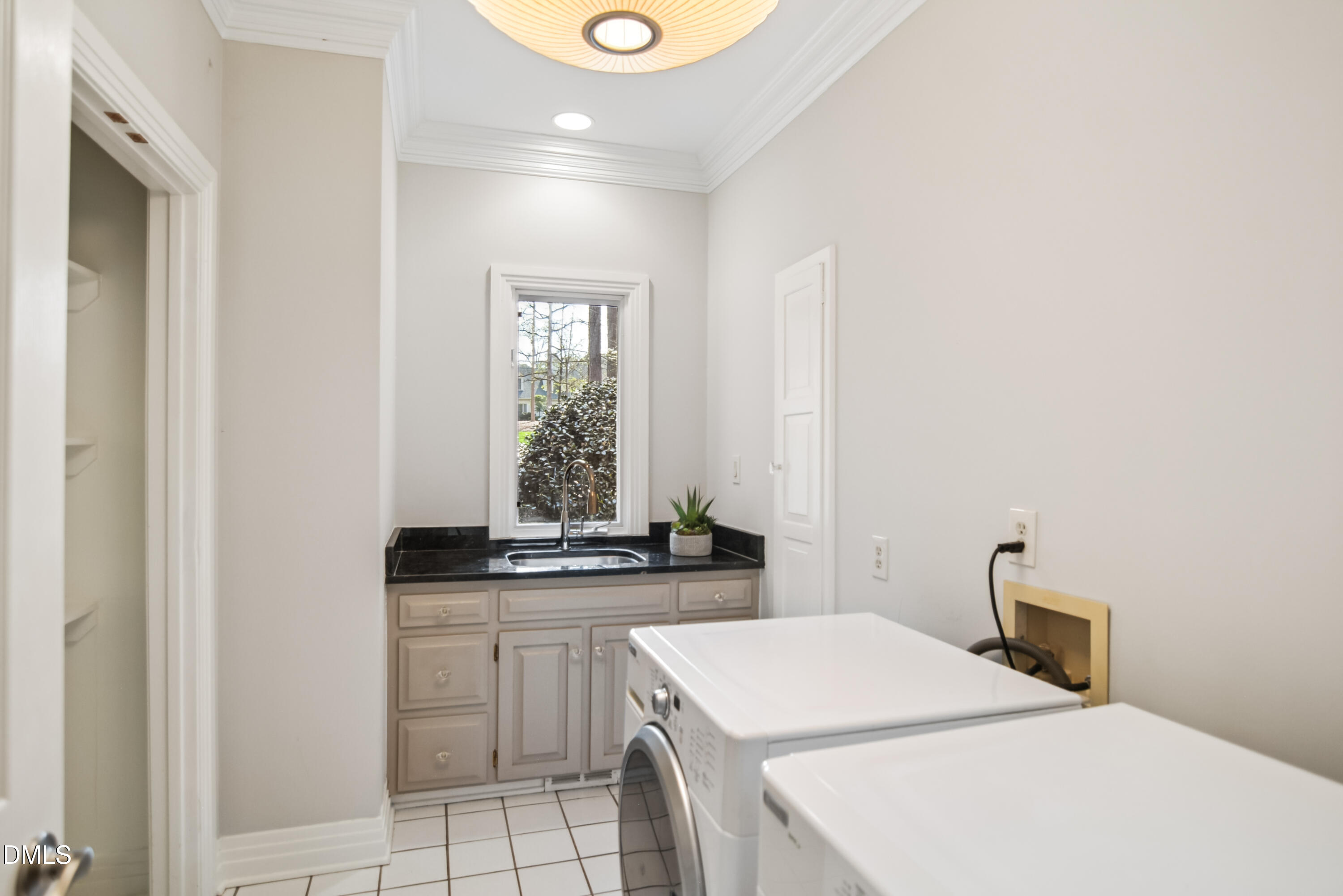9933 Koupela Drive Raleigh, NC 27614 - Photo 34 of 59 a kitchen that has a sink and a stove in it