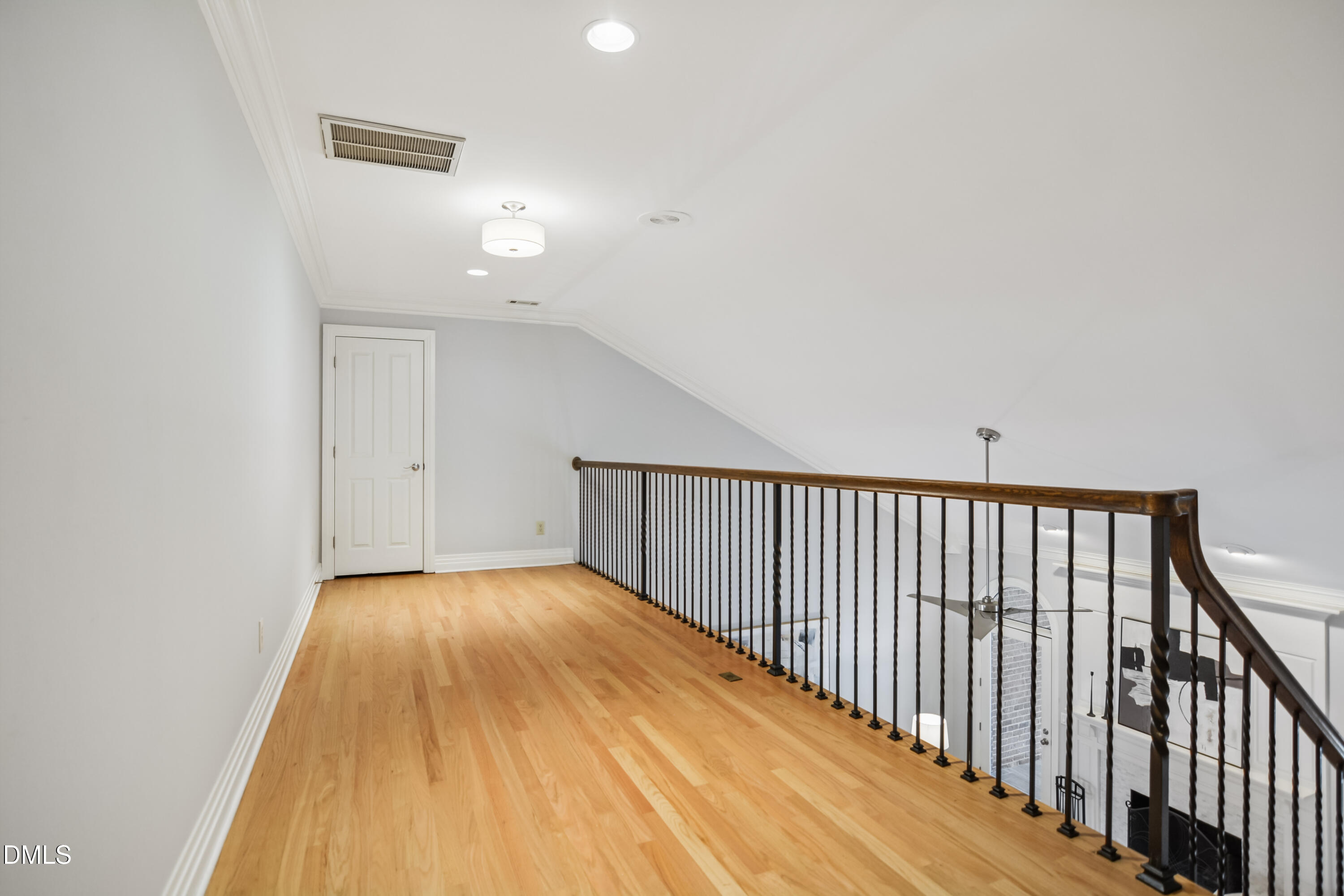 9933 Koupela Drive Raleigh, NC 27614 - Photo 35 of 59 a view of a hallway with wooden floor