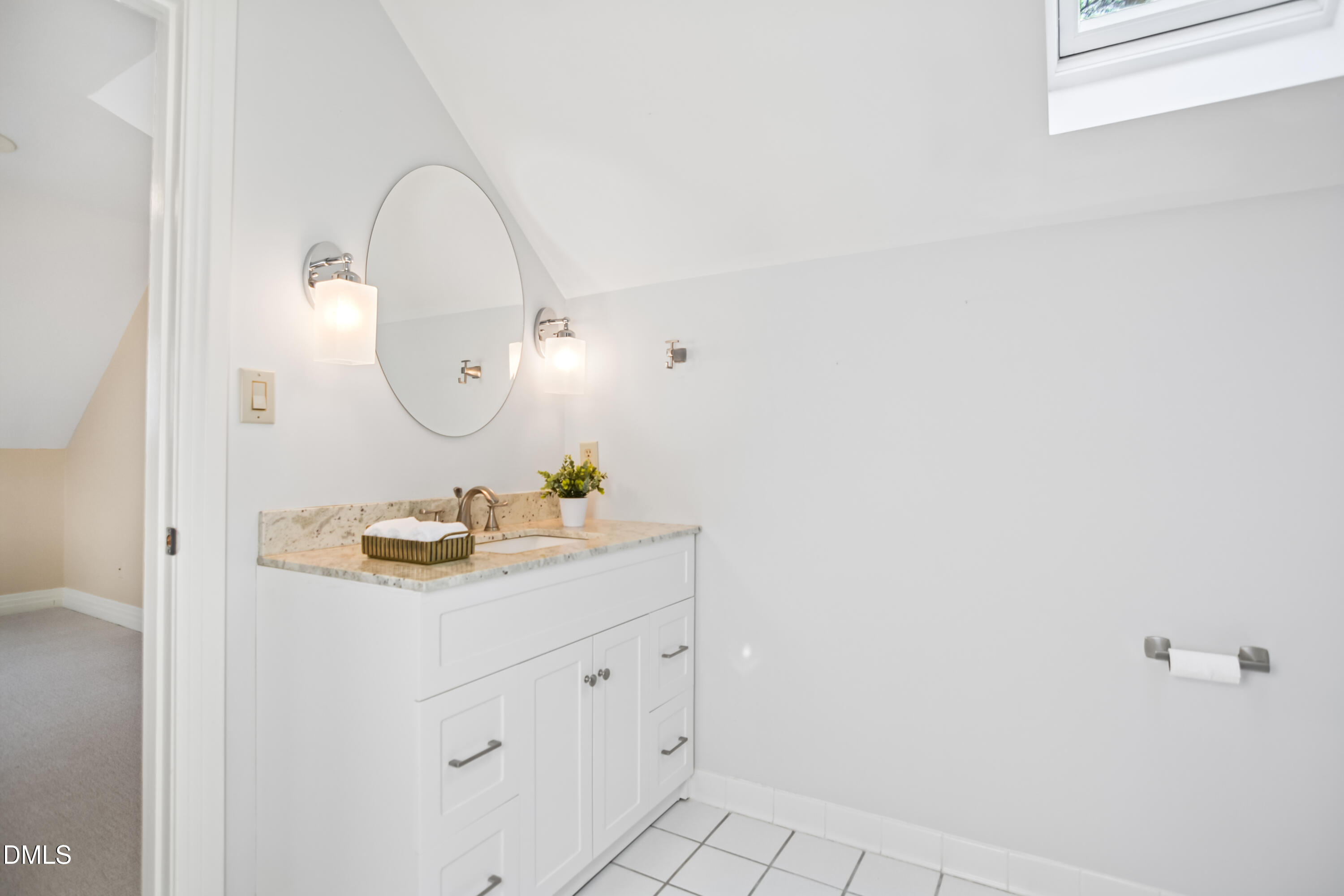 9933 Koupela Drive Raleigh, NC 27614 - Photo 40 of 59 a bathroom with a sink and a mirror