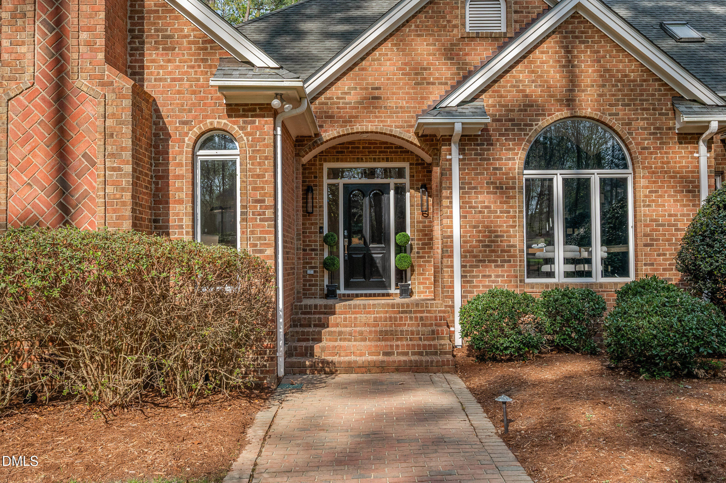 9933 Koupela Drive Raleigh, NC 27614 - Photo 4 of 59 a view of a brick house with many windows