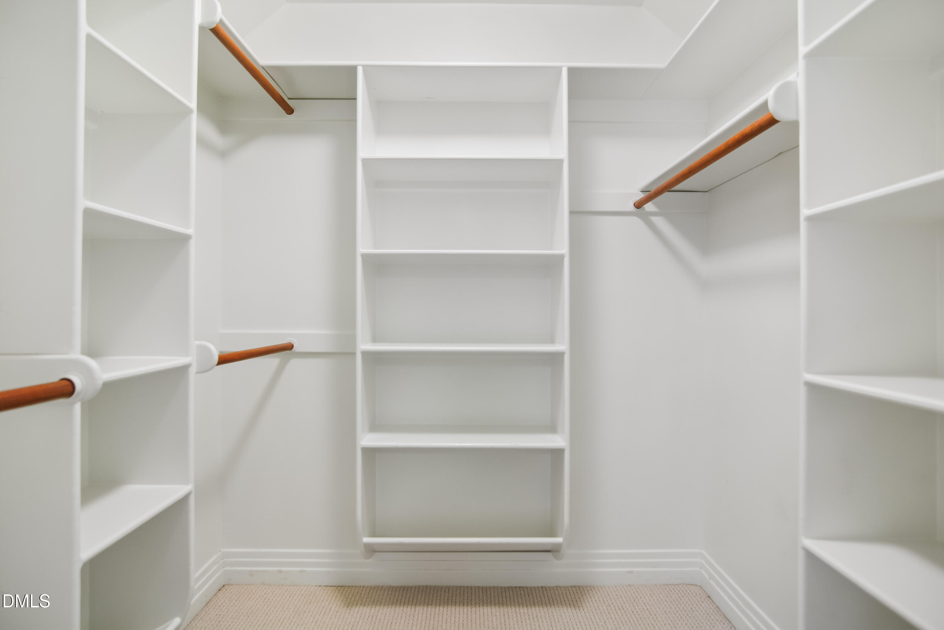 9933 Koupela Drive Raleigh, NC 27614 - Photo 42 of 59 a view of walk in closet with empty racks