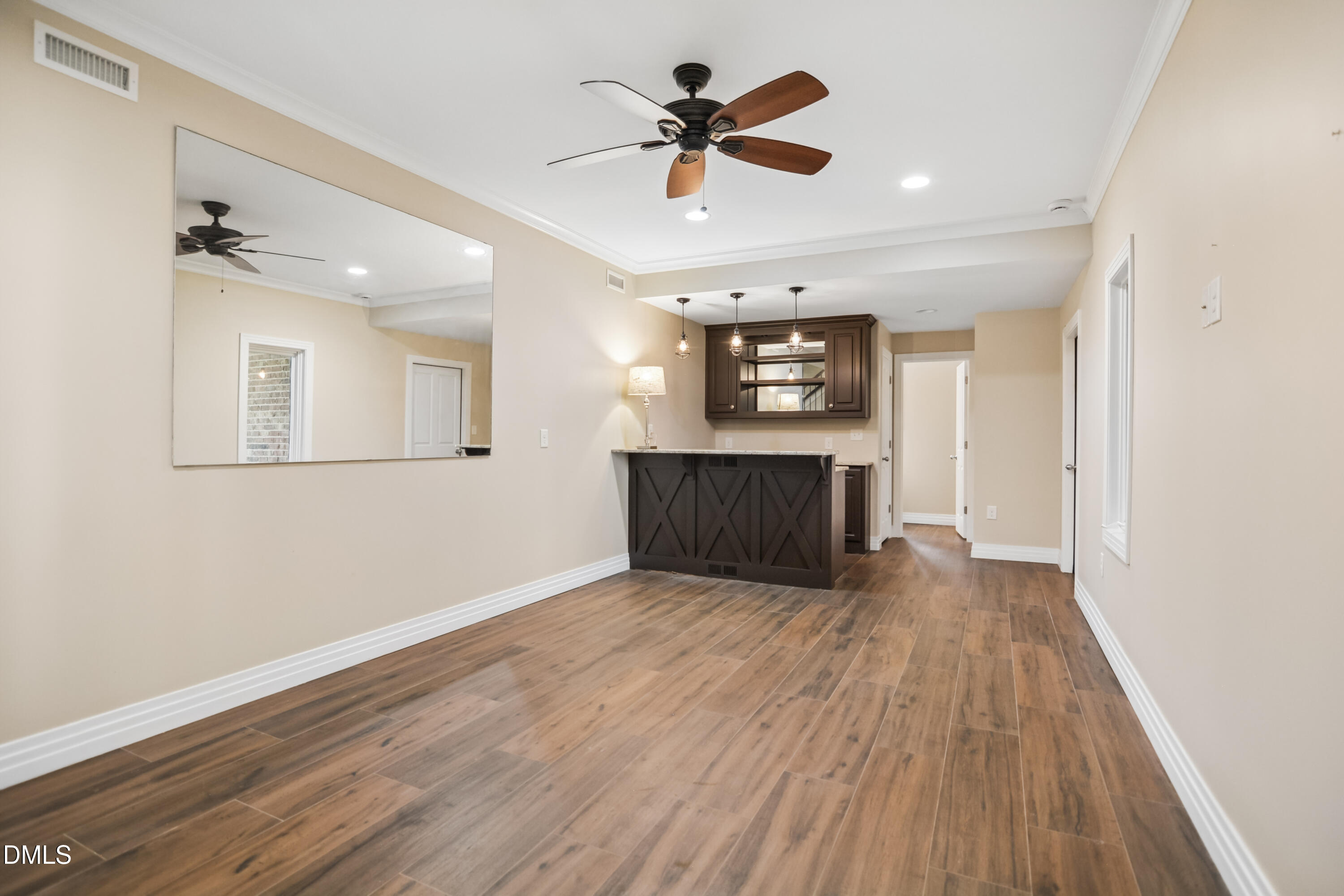 9933 Koupela Drive Raleigh, NC 27614 - Photo 43 of 59 a view of kitchen and hall with wooden floor