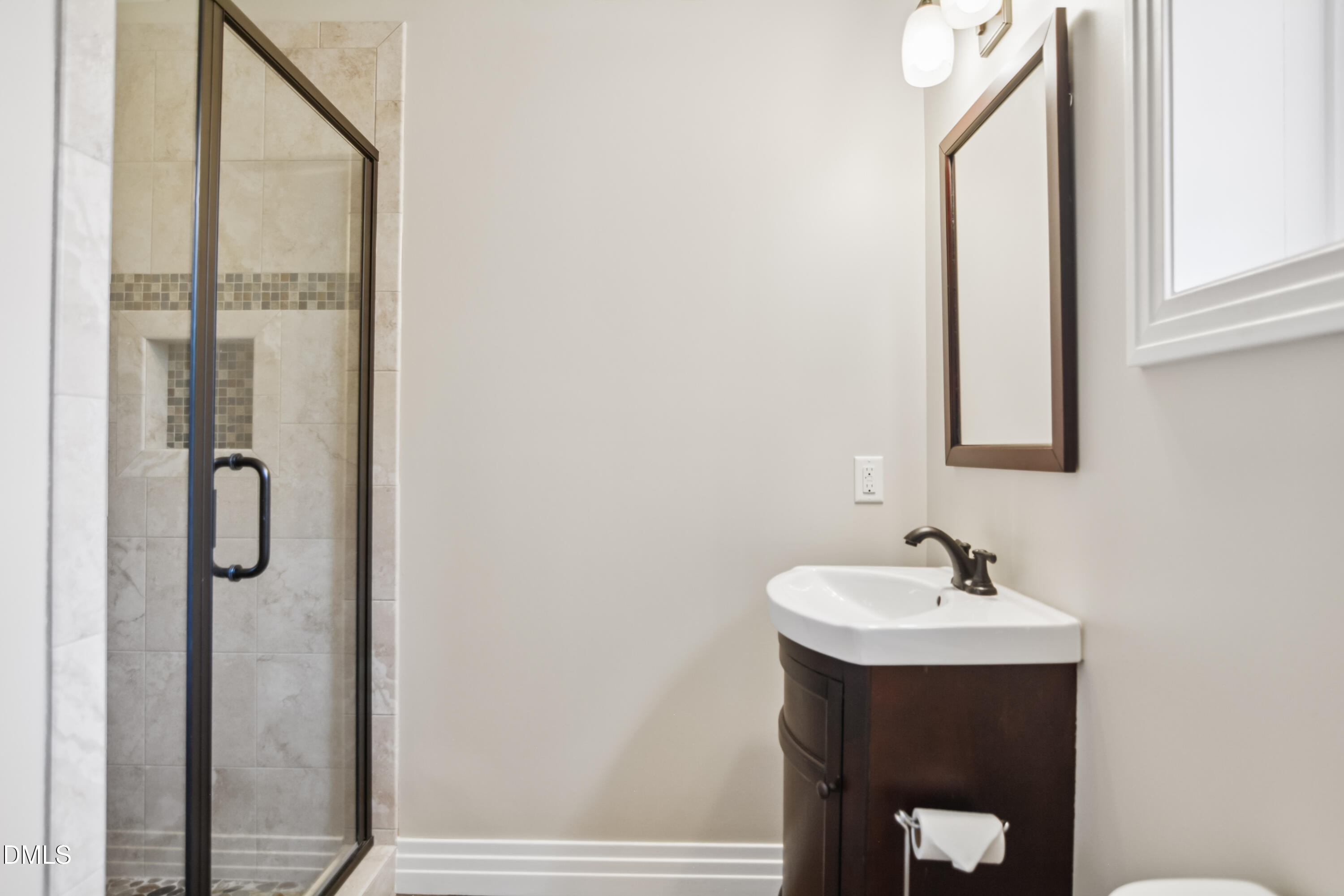 9933 Koupela Drive Raleigh, NC 27614 - Photo 45 of 59 a bathroom with a sink and mirror