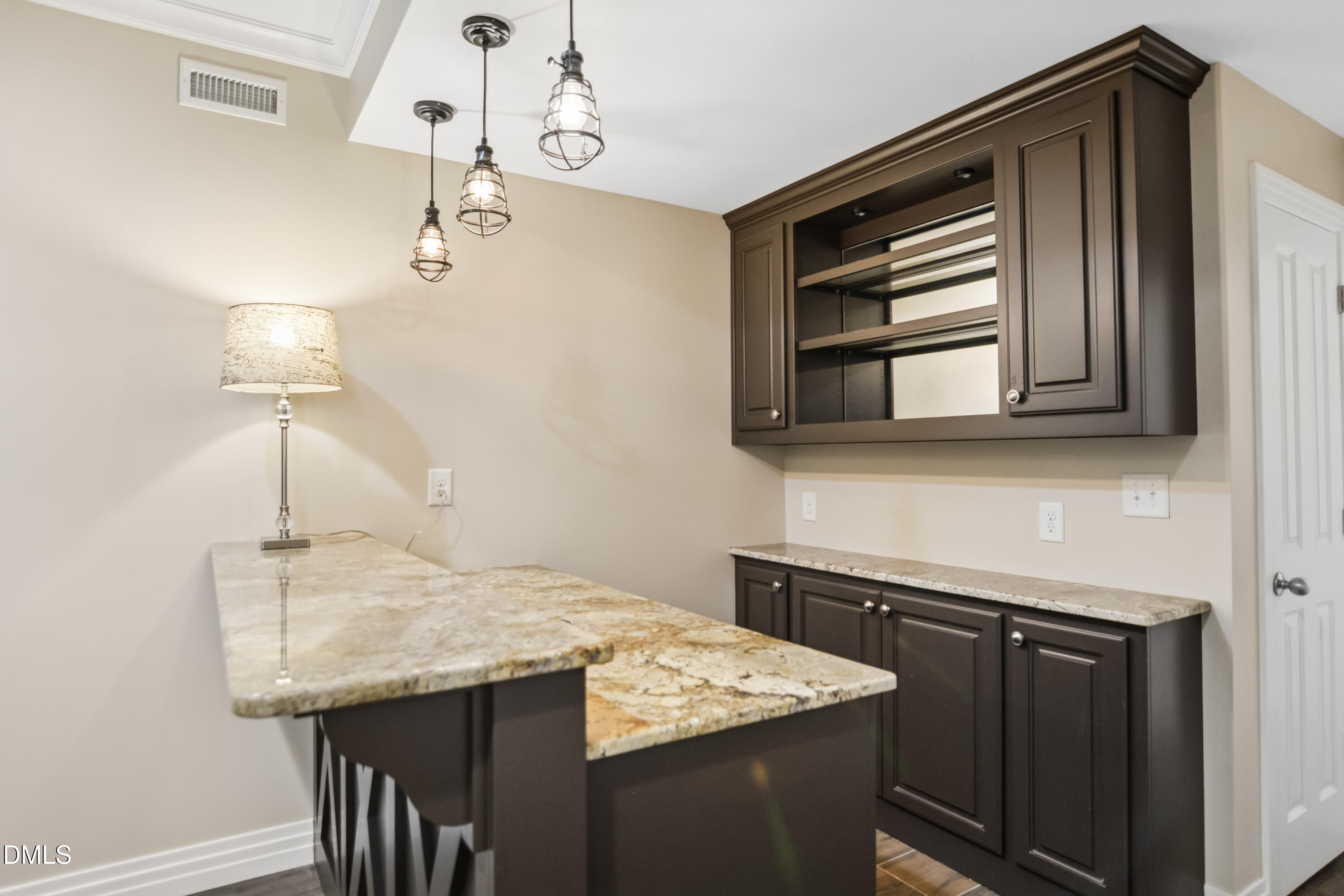 9933 Koupela Drive Raleigh, NC 27614 - Photo 46 of 59 a kitchen with a sink a microwave and refrigerator