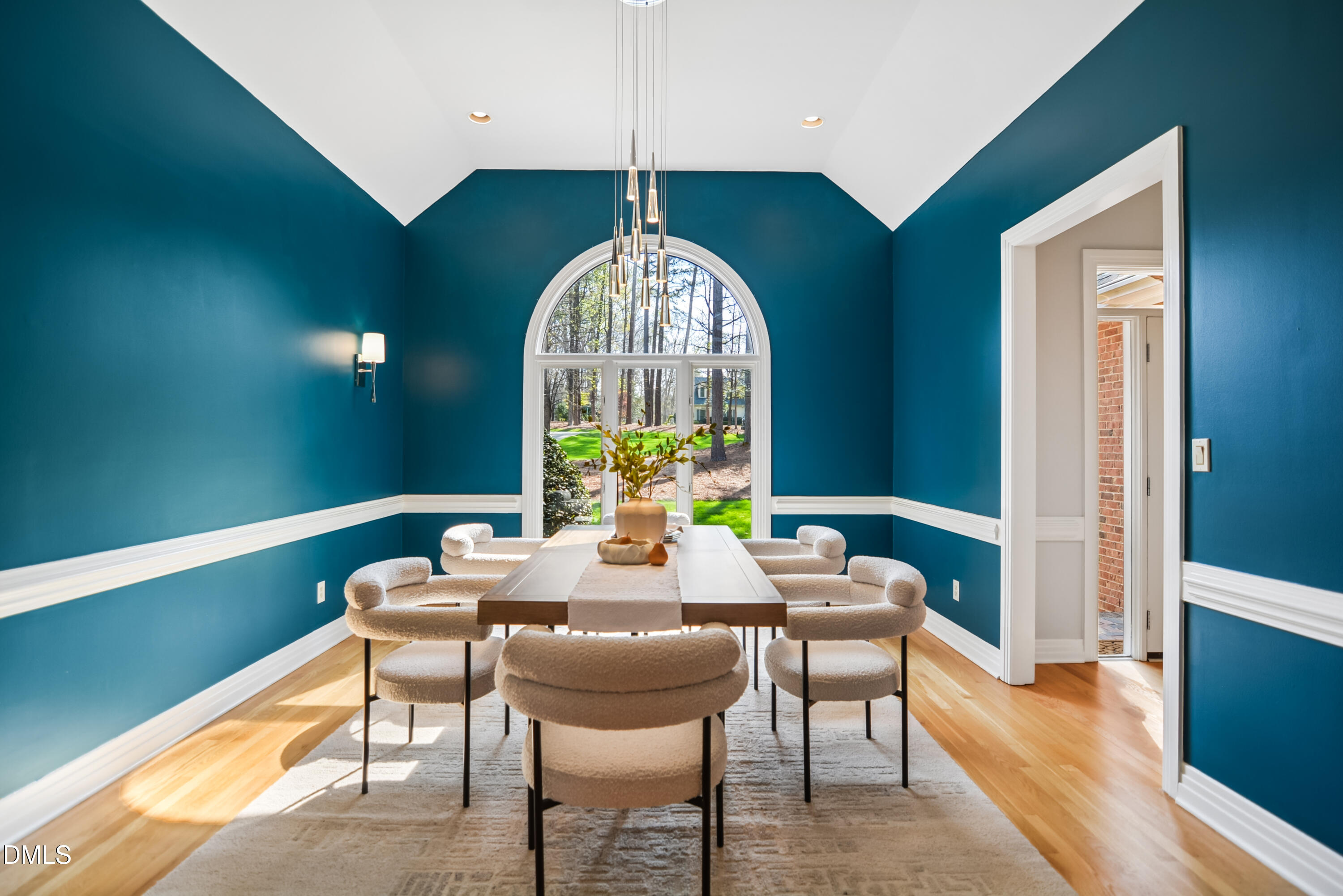 9933 Koupela Drive Raleigh, NC 27614 - Photo 9 of 59 a view of a dining room with furniture window and wooden floor