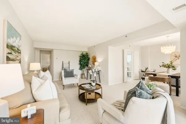a living room with furniture and a table