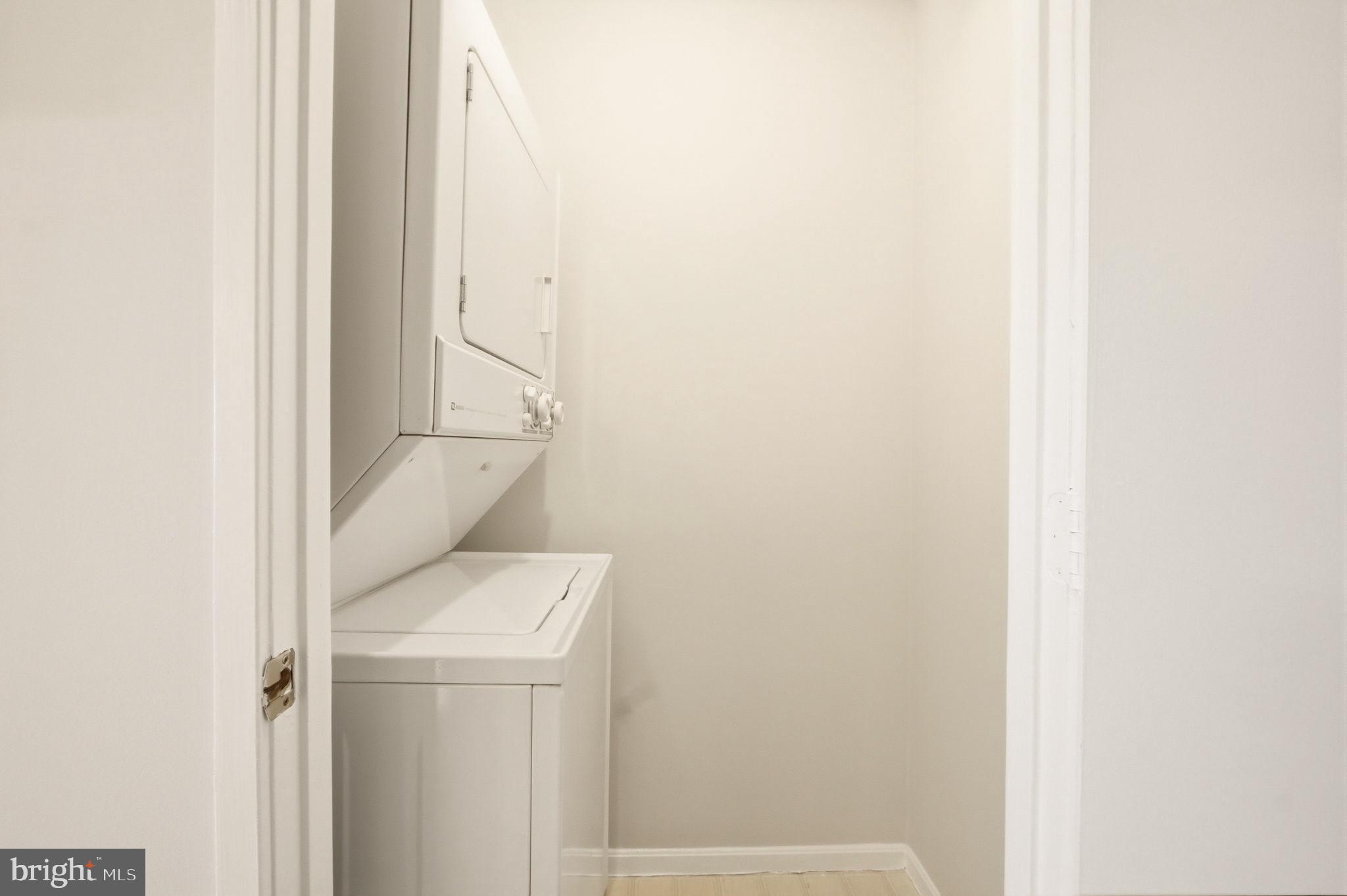 3330 North Leisure World Boulevard, Unit 5627 Silver Spring, MD 20906 - Photo 23 of 35 Stackable washer and dryer in laundry closet