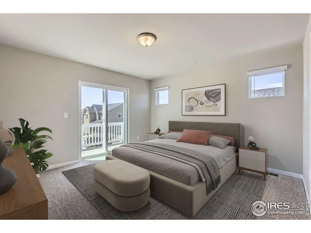 a bedroom with a bed plant and a window