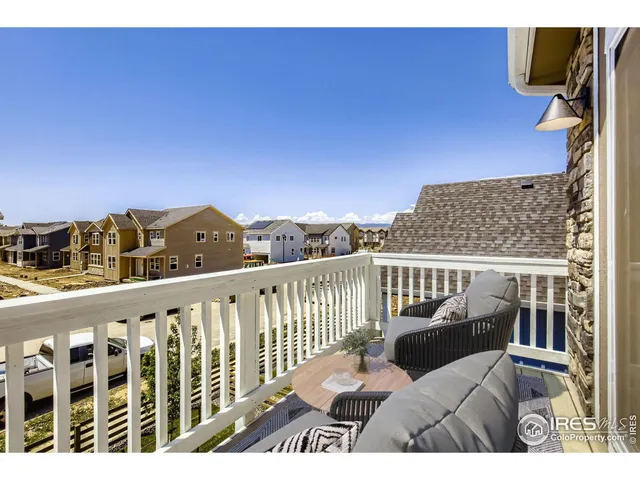 a view of balcony with furniture