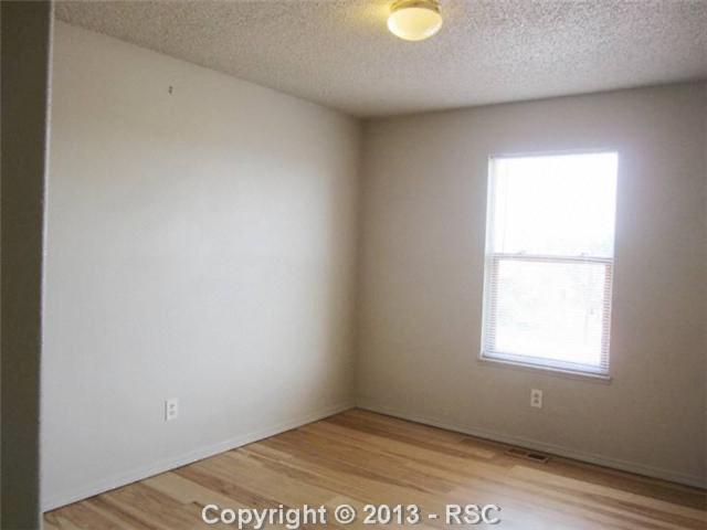609 Rye Ridge Road Fountain, CO 80817 - Photo 11 of 12 One of 2 secondary bedrooms.