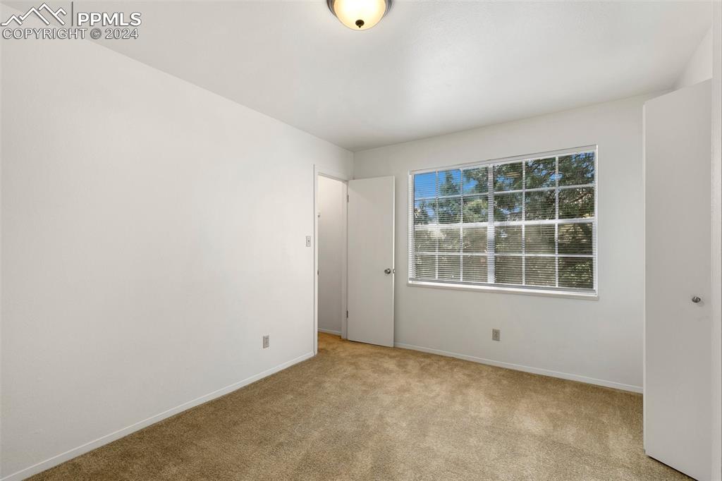 2902 Airport Road, Unit 215 Colorado Springs, CO 80910 - Photo 12 of 17 an empty room with a window