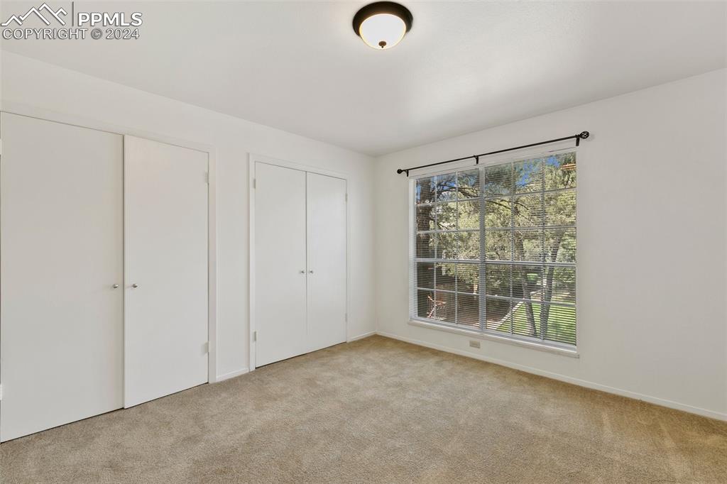 2902 Airport Road, Unit 215 Colorado Springs, CO 80910 - Photo 10 of 17 a view of an empty room with a window