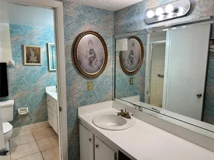 a bathroom with a toilet and a sink