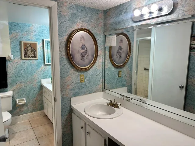 a bathroom with a toilet and a sink