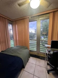 a green field covered with trees