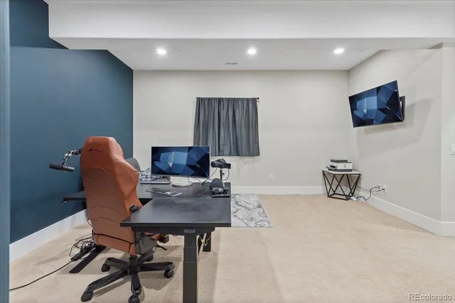 a workspace with furniture and mirror