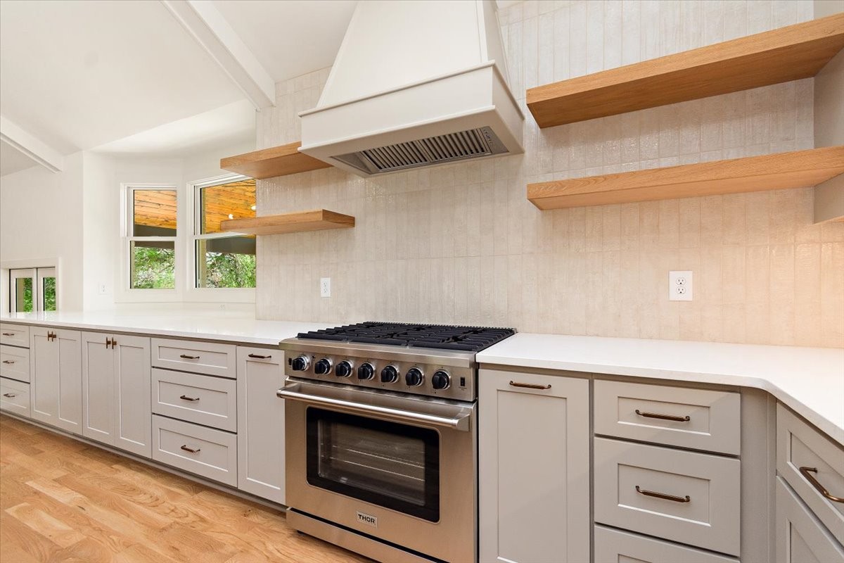 1409 Sneed Road West Franklin, TN 37069 - Photo 12 of 63 a kitchen with cabinets appliances and a window