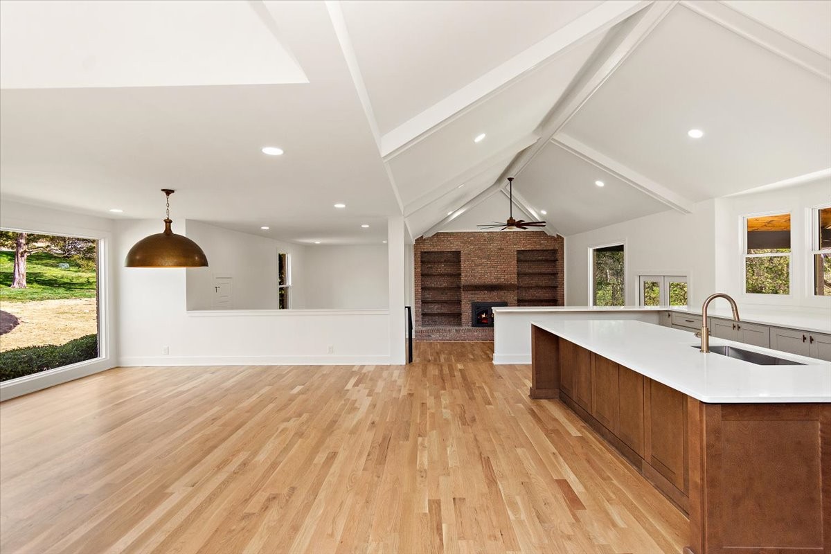 1409 Sneed Road West Franklin, TN 37069 - Photo 14 of 63 a large kitchen with stainless steel appliances a large counter top a stove a sink and a refrigerator