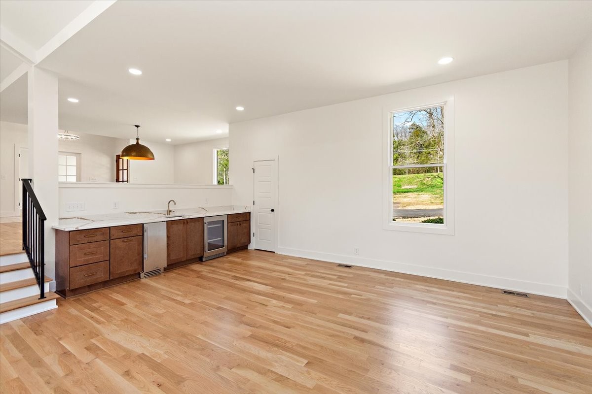 1409 Sneed Road West Franklin, TN 37069 - Photo 21 of 63 a view of a kitchen with a sink cabinets and a wooden floor