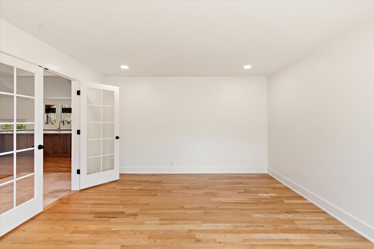 1409 Sneed Road West Franklin, TN 37069 - Photo 25 of 63 a view of empty room with wooden floor and door