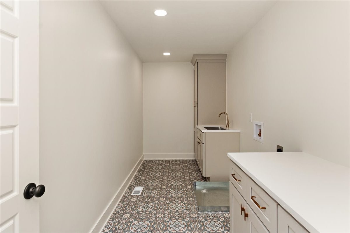 1409 Sneed Road West Franklin, TN 37069 - Photo 27 of 63 a bathroom with a sink a toilet and a shower