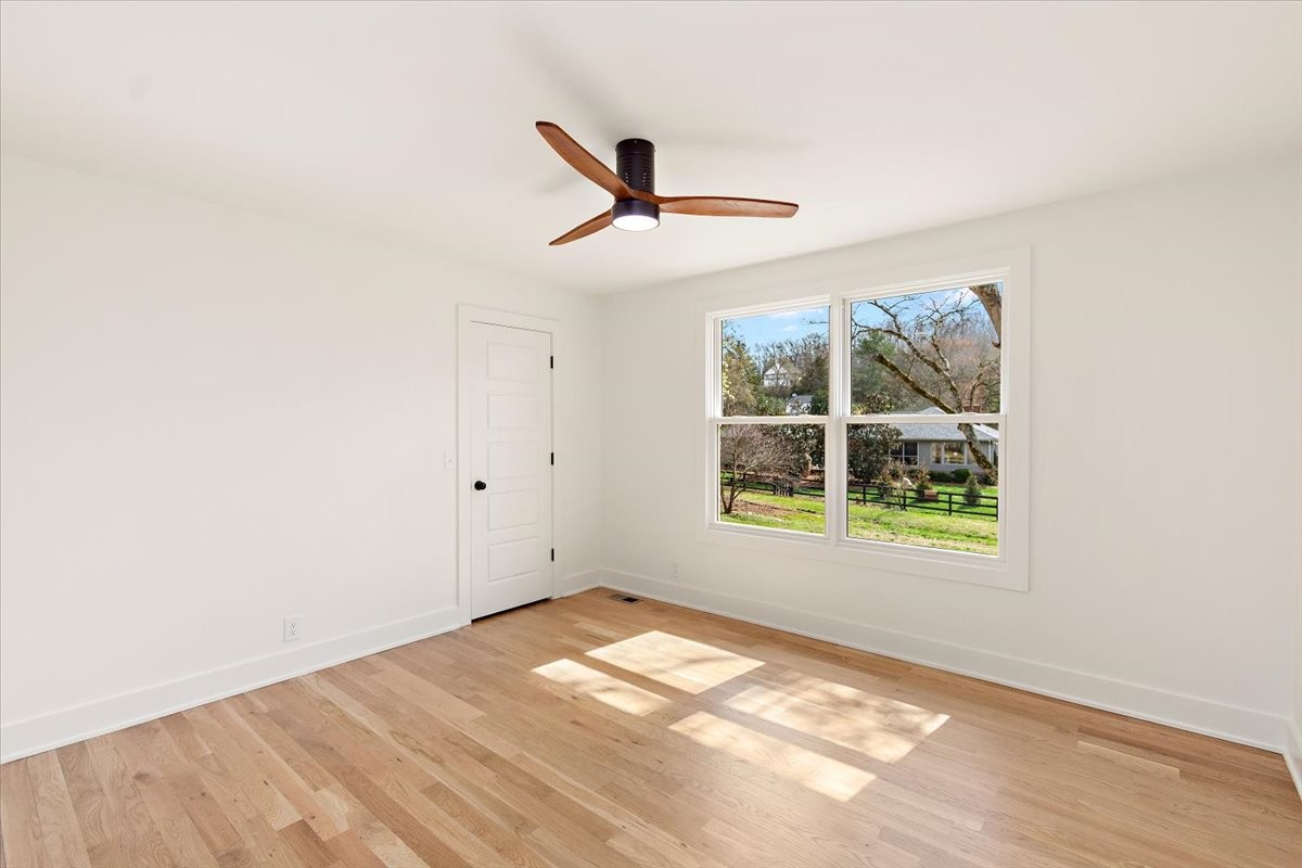 1409 Sneed Road West Franklin, TN 37069 - Photo 39 of 63 a view of empty room with window and ceiling fan