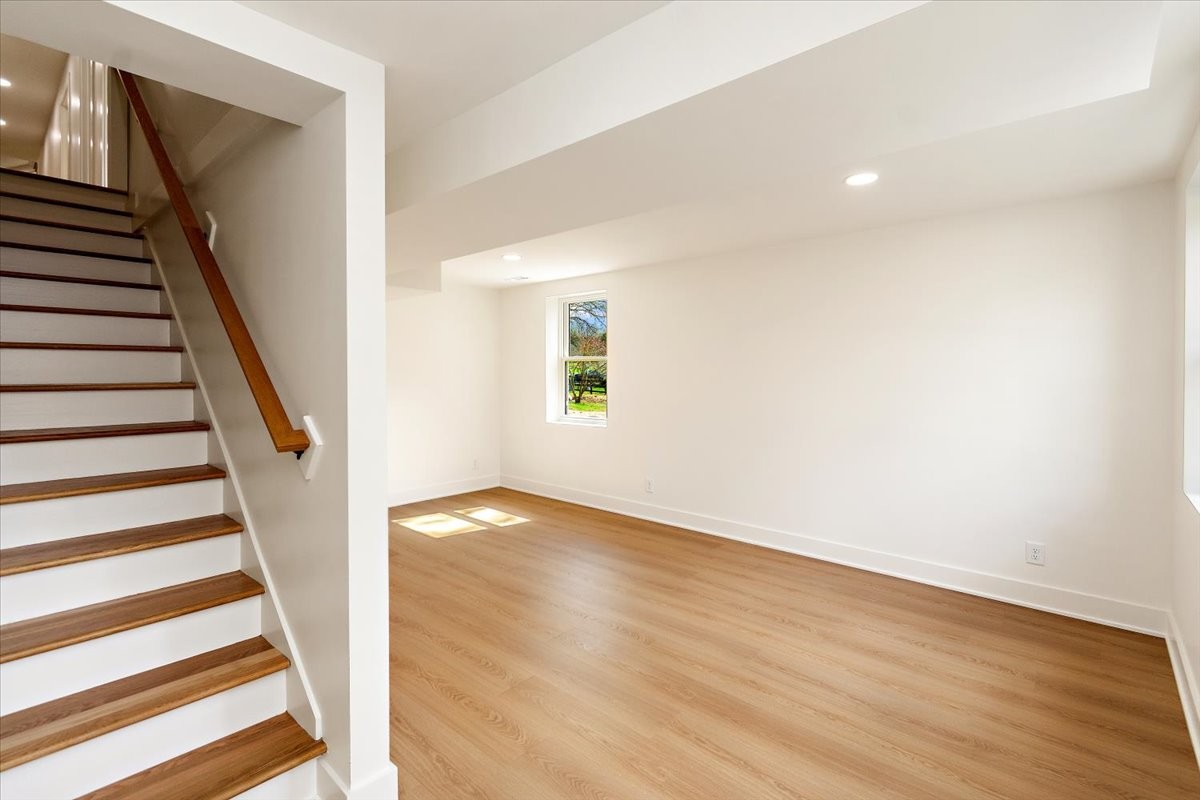 1409 Sneed Road West Franklin, TN 37069 - Photo 40 of 63 an empty room with wooden floor and windows