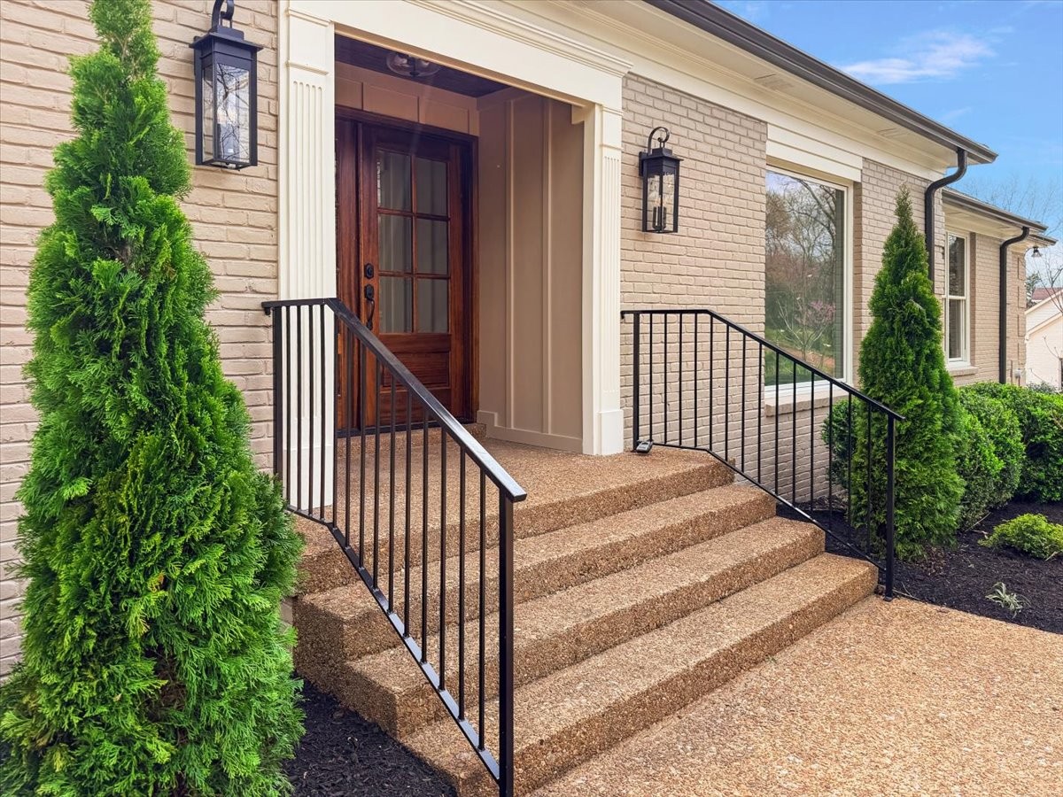 1409 Sneed Road West Franklin, TN 37069 - Photo 4 of 63 a view of a house with wooden stairs