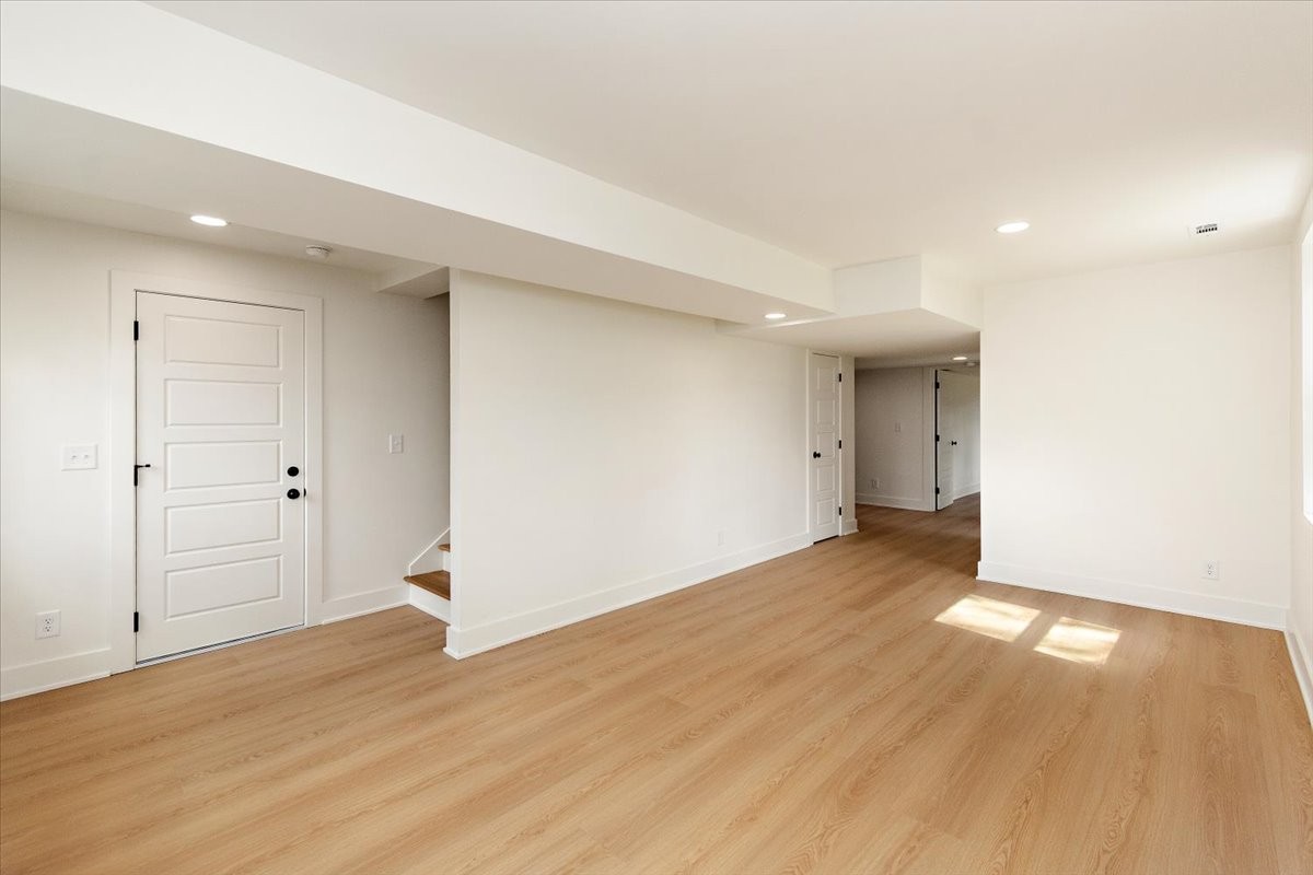 1409 Sneed Road West Franklin, TN 37069 - Photo 41 of 63 an empty room with wooden floor and windows