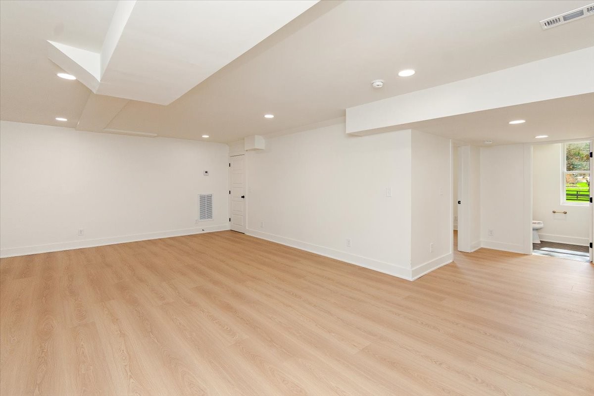 1409 Sneed Road West Franklin, TN 37069 - Photo 45 of 63 an empty room with wooden floor and windows