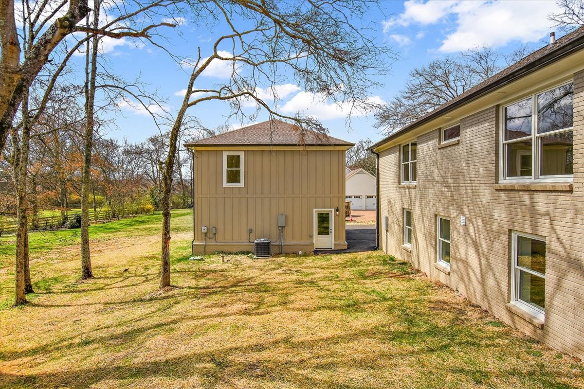 1409 Sneed Road West Franklin, TN 37069 - Photo 50 of 63 a view of a house with a backyard