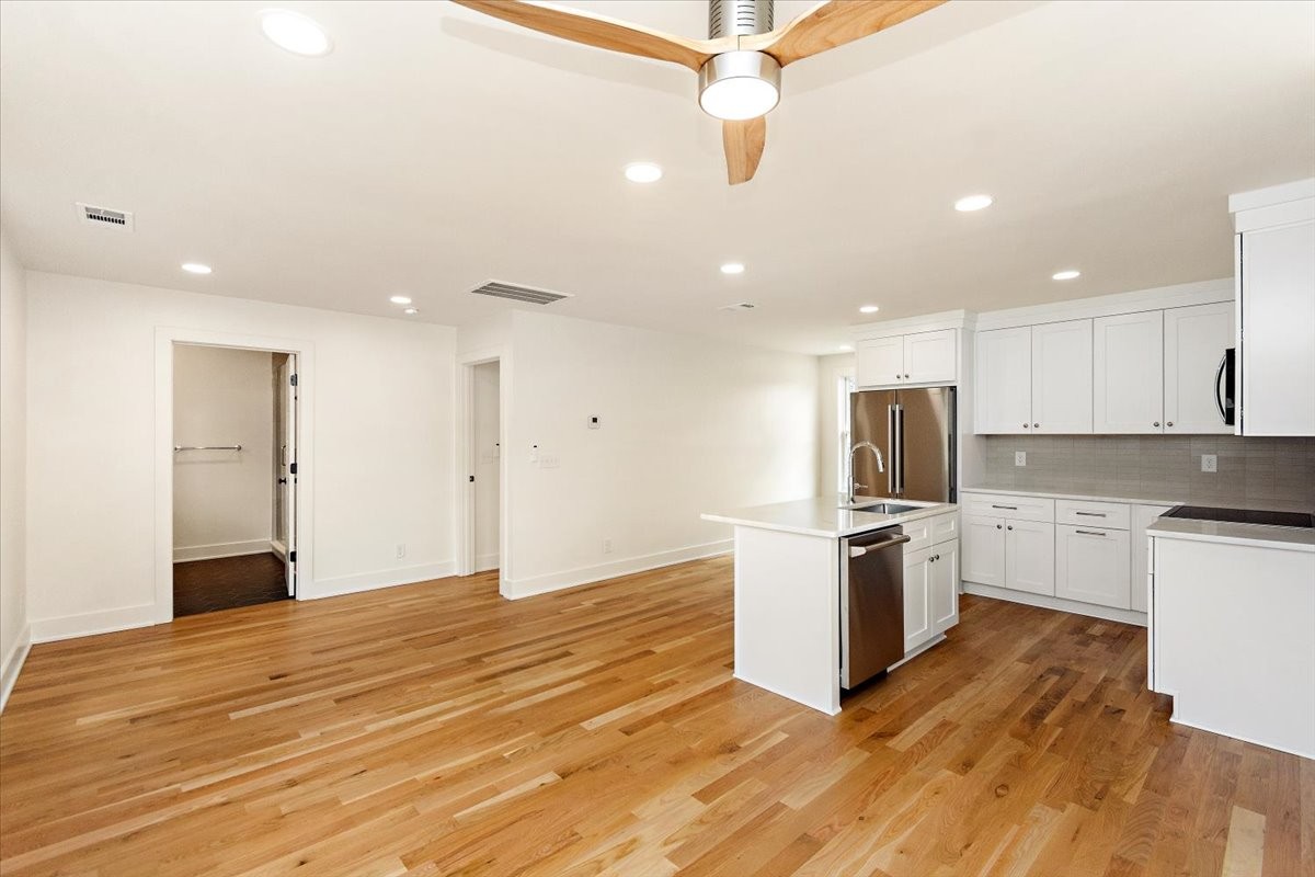 1409 Sneed Road West Franklin, TN 37069 - Photo 52 of 63 a kitchen with stainless steel appliances granite countertop a refrigerator a stove a sink and a microwave