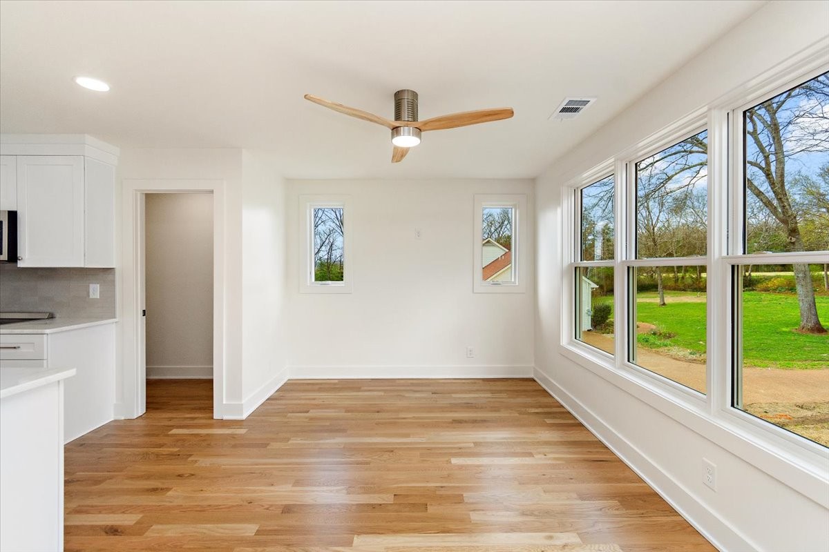 1409 Sneed Road West Franklin, TN 37069 - Photo 55 of 63 a view of empty room with wooden floor and fan