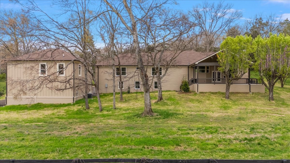 1409 Sneed Road West Franklin, TN 37069 - Photo 61 of 63 a swimming pool with trees in the background