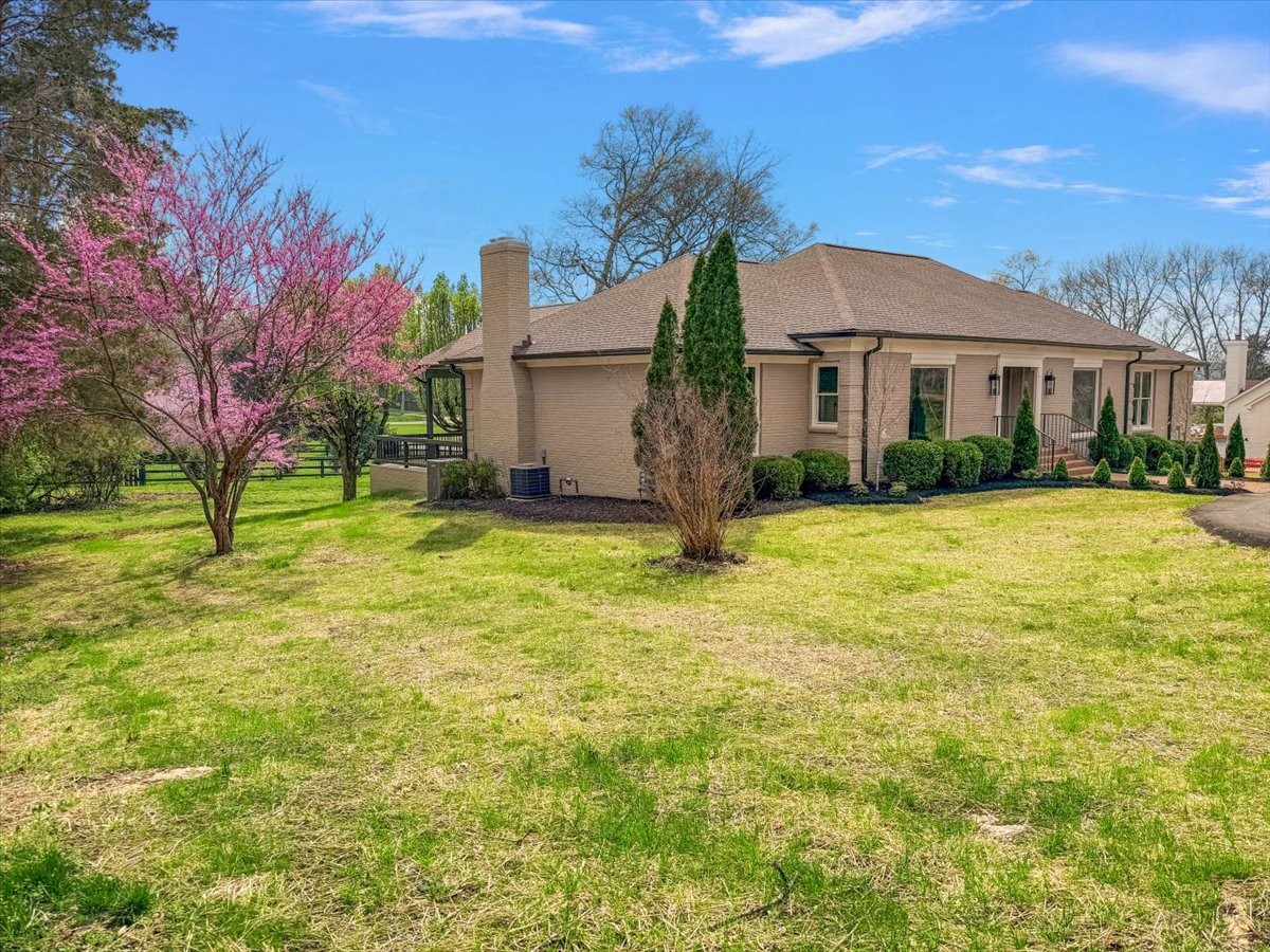 1409 Sneed Road West Franklin, TN 37069 - Photo 63 of 63 a view of a house with a yard and tree s