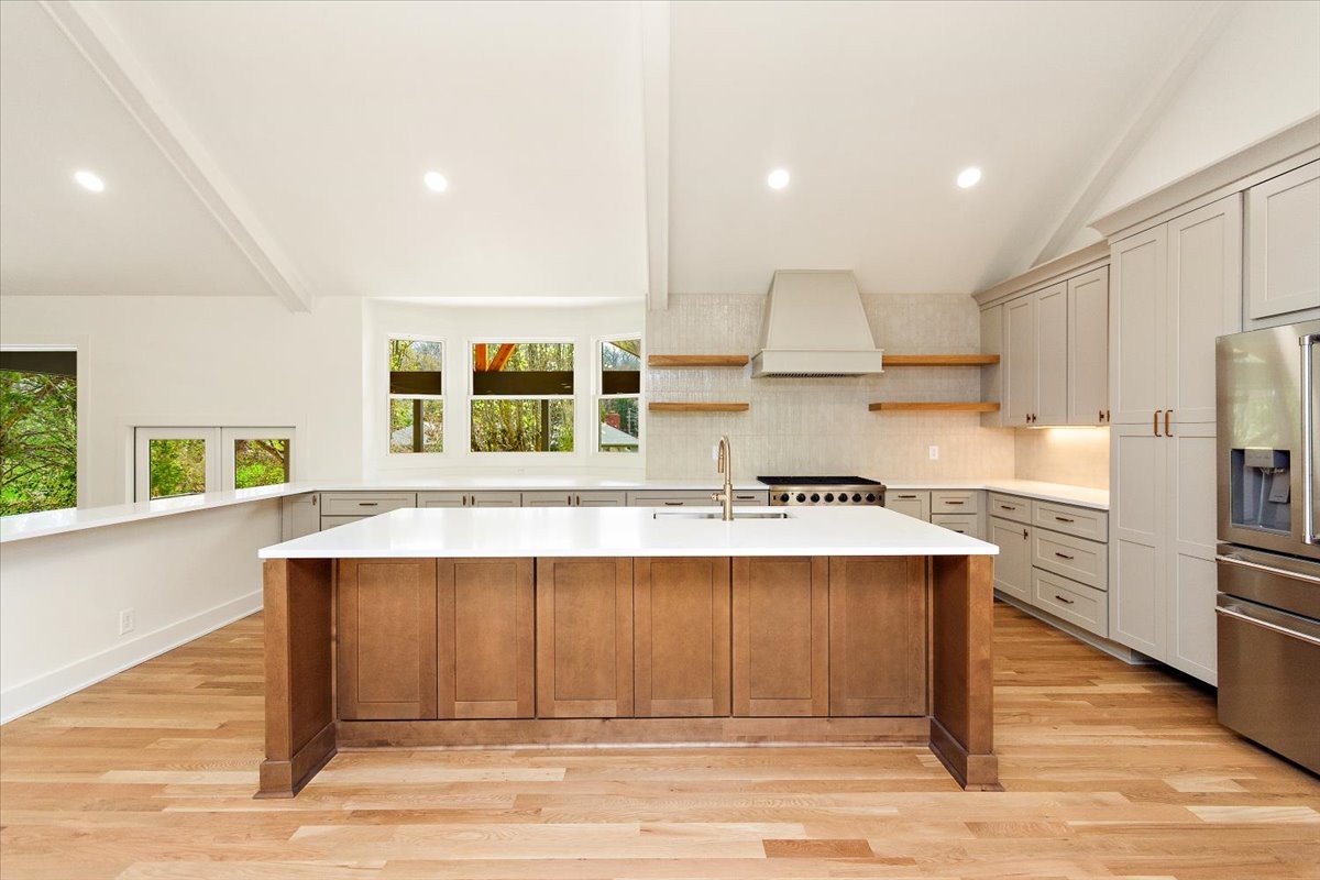 1409 Sneed Road West Franklin, TN 37069 - Photo 9 of 63 a kitchen with stainless steel appliances granite countertop a stove and a refrigerator