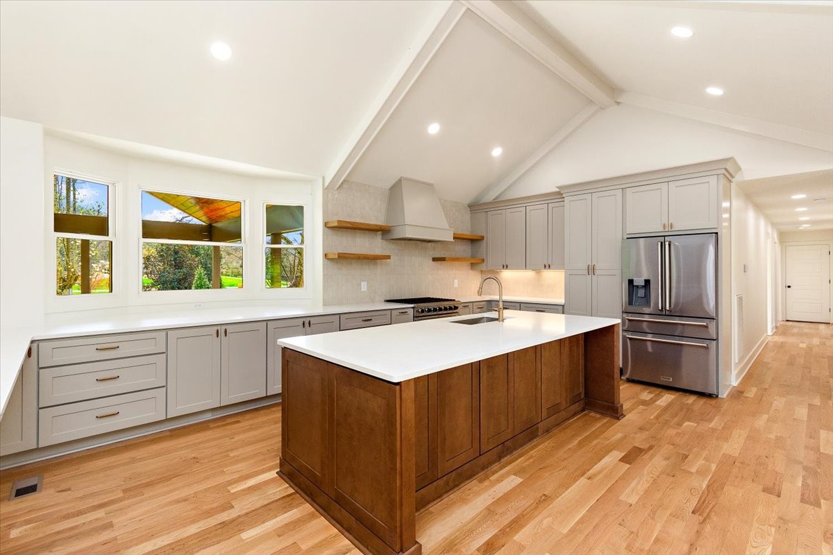1409 Sneed Road West Franklin, TN 37069 - Photo 10 of 63 a kitchen with a stove a refrigerator and a sink